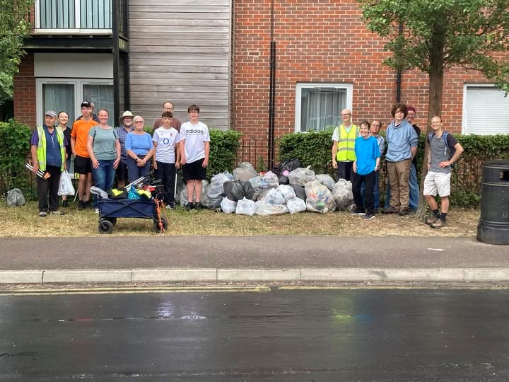 Keep Caversham Tidy stand proudly beside their collected litter