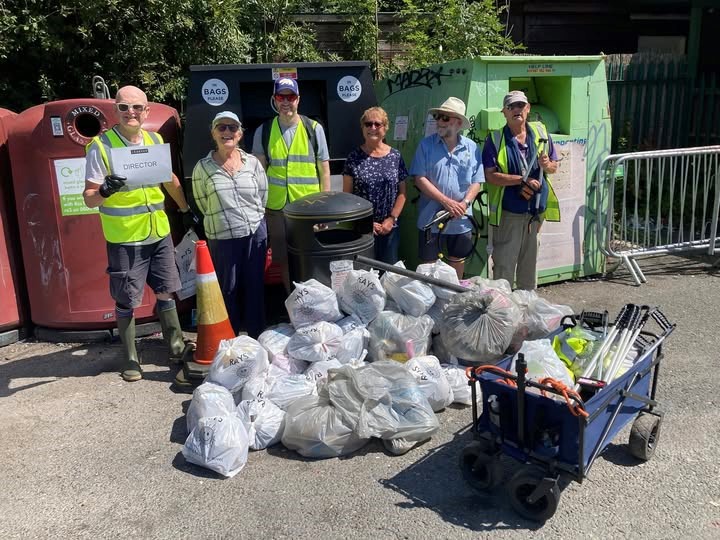 Keep Caversham Tidy stand proudly beside their collected litter in Hills Meadow car park